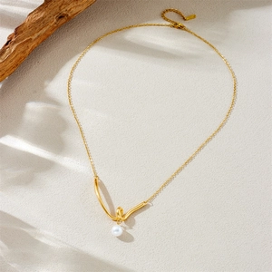 Minimalist gold plated stainless steel necklace with twisted V pendant and single pearl detail