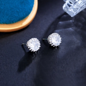 Macro shot of 8mm crown stud earrings with clear round cubic zirconia and silver base