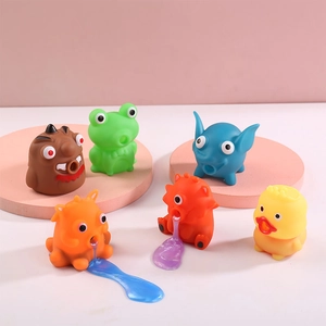 Funny animal squeeze slime toys set in bright colors on a pink platform display