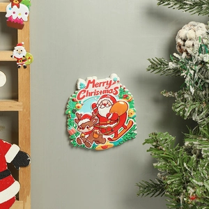 Detail of Santa on a sleigh resin fridge magnet against a green wall with festive decor