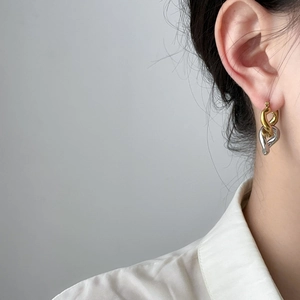 Minimalist intertwined chain link earrings in two-tone gold and silver titanium steel