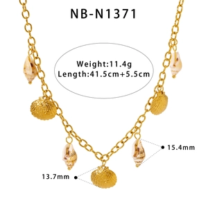 Detail view of gold shell and scallop pendants necklace with length measurements