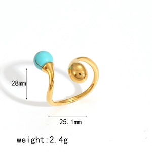 Golden double-head open ring with tiger eye stone and droplet charm on white background