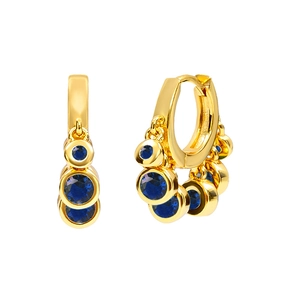 Detailed view of gold hoop earrings with multiple blue round crystals on white background