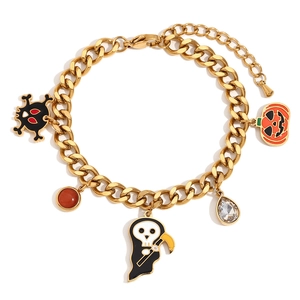 Halloween charm bracelet with pumpkin and skull pendants in 18K gold plated finish