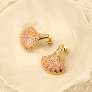 Elegant gold-plated fan-shaped earrings with pink enamel inlay on white lace background