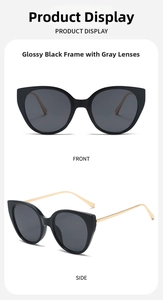 Macro detail of large frame sunglasses with bright black frame and gold metal temples