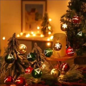 Hanging Christmas ball lights with Merry Christmas prints and warm LED glow for decor