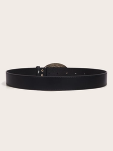 Detail of vintage black leather belt with metal buckle and five-hole adjustment design