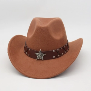 Detail of vintage brown cowboy hat with leather band and silver star emblem