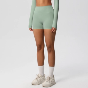 Detail of high waisted brushed green seamless yoga shorts with fine knit texture