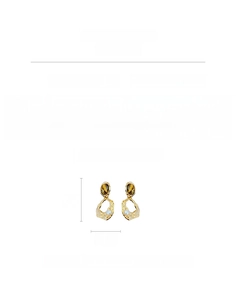 Macro detail of oval tiger eye stone earrings with faux pearl and gold plating specs