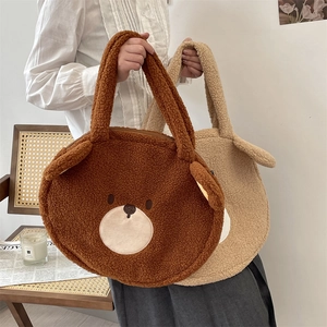 Detailed view of plush teddy bear tote bags in brown and beige with soft faux fur texture