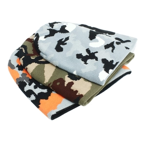 Detailed set of three camo knit beanies in gray, woodland green, and vibrant orange