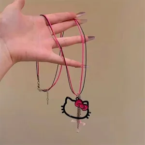 Hello Kitty themed necklace with black wire frame pendant and pink bow on wax rope