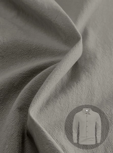 Detailed texture of grey linen fabric on long sleeve men shirt with close-up view