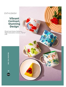 Detail of colorful floral ceramic mugs featuring tropical hibiscus patterns on wood tray