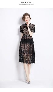Detailed view of intricate floral lace patterns and hollowed structure of the black dress