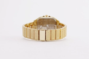 Detailed view of the iced-out gold watch band with crystal inlay and folding clasp