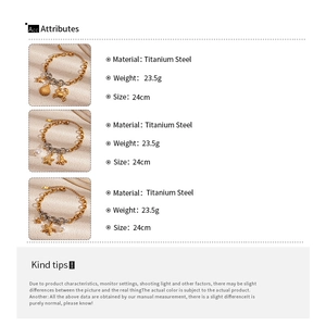 Detail view of 24cm titanium steel ocean charm bracelet with crab and shell pendants