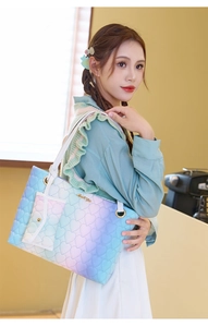 Rainbow gradient tote bag with heart quilting and small charm pouch on shoulder