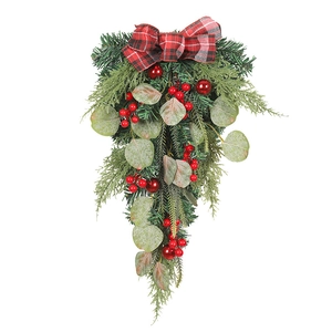 Christmas eucalyptus swag with red berries and plaid bow for home holiday door decor