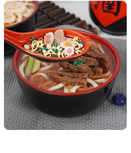 Macro detail of realistic miniature Japanese ramen food model with spoon lifting noodles