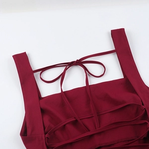 Detail of square neckline and delicate tie straps on a burgundy summer sleeveless dress