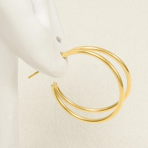 French style double hoop gold earrings in 304 stainless steel shown on a model
