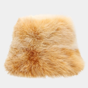 Macro shot of fluffy ginger faux fur texture on a warm winter bucket hat for women