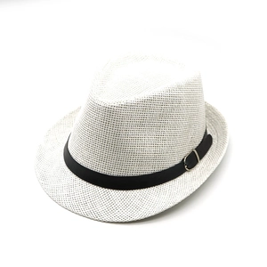 Close-up of white woven straw fedora hat featuring a black band with silver buckle detail