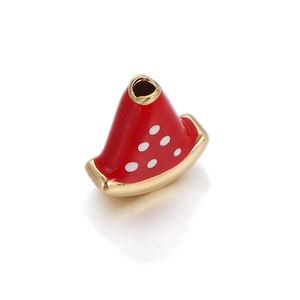 Detailed macro shot of a cute watermelon enamel bead with gold-plated trim for DIY jewelry