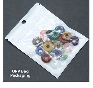 Macro shot of assorted natural crystal stone donuts packaged in clear OPP bags