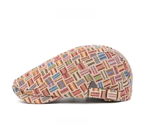 Detail view of colorful geometric woven pattern on a retro British style ivy cap