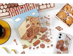 Detail of bakery themed PET stickers featuring cat and bear chefs on a white desk