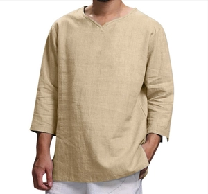 Detailed texture of men's V-neck cotton linen shirt in khaki with high-quality draping
