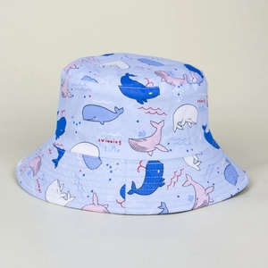 Detailed close-up of light blue cotton bucket hat with cute cartoon whale patterns