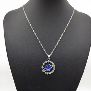 Blue planet star and moon necklace on black mannequin with silver chain and zircon inlay