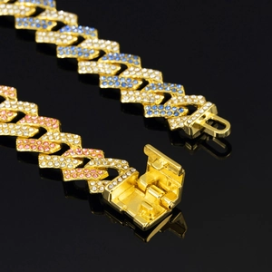 15mm Cuban link chain bracelet in pink and blue rhinestones on black reflective surface