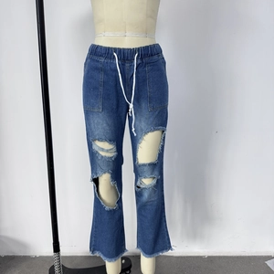 Detail of dark blue distressed jeans with elastic drawstring waist and ripped knees