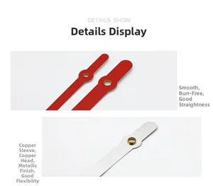 Macro detail of red and silver quartz clock hands with premium copper sleeve and metal finish