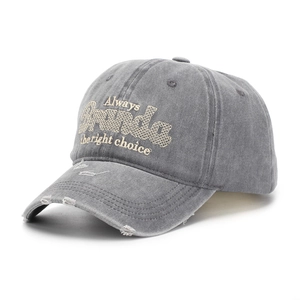 Detailed close-up of distressed brim and embroidery on dark grey washed cotton baseball cap