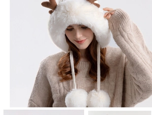 Detail of white plush reindeer hat with brown antlers and soft fur texture for winter