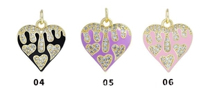 Detailed view of 18K gold plated heart pendants with colorful enamel and zircon inlays
