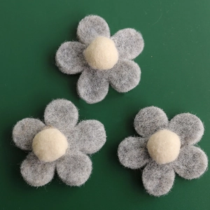 Three grey and white wool felt flowers for Christmas tree decoration and DIY crafts