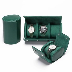 Detailed view of dark green leather watch roll with premium suede lining and metal buttons