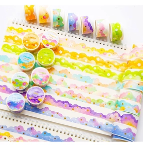 Close-up of cloud-shaped washi tape with gold stamping and dreamy gradient colors