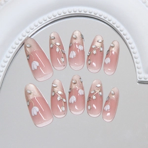 French style almond press-on nails with cat eye shimmer and 3D floral rhinestone accents