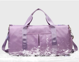 Waterproof purple sports bag with wet dry separation and adjustable shoulder strap
