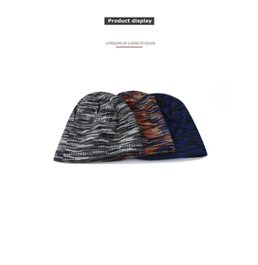 Detail display of three colorful thick knit beanies showing fine texture and knit patterns